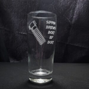 Beer glass engraved with the saying, "Sippin brews bolt by bolt' and the image of a bolt