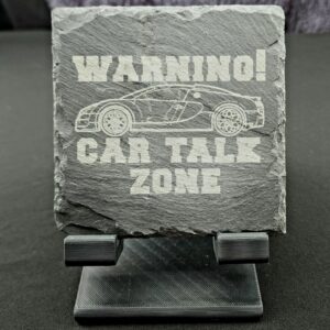"Warning - Car Talk Zone" Engraved slate coaster. This coaster features an image of an outline of a bugatti with the saying around it in bold font engraved into a natural slate coaster.
