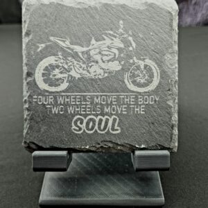 Natural Slate Coaster that has the image of a motorcycle with the saying, 4 wheels move the body, 2 wheels move the soul.