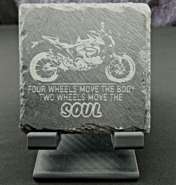 Natural Slate Coaster that has the image of a motorcycle with the saying, 4 wheels move the body, 2 wheels move the soul.