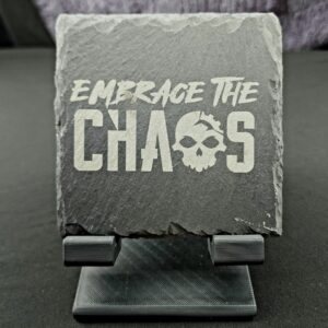 Natural Slate coaster engraved with the saying "Embrace the Chaos" utilizing our gearhead logo in the word Chaos.
