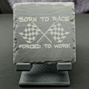 Natural Slate Coaster engraved with 2 crossed checkered flags and the saying "Born to Race, Forced to Work"
